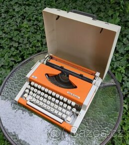 Vintage oranžový psací stroj UNIS tbm de Luxe