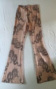 Béžové kalhoty s designem draka