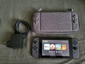 Nintendo Switch + pouzzdro + 1 hra dle výběru