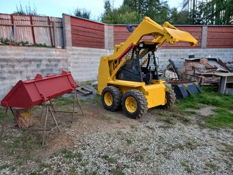 smykový nakladač  Komatsu SK 09J - 2