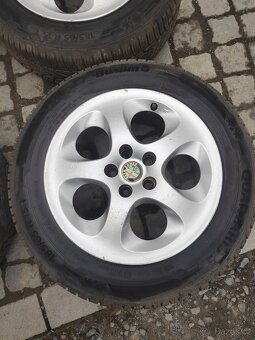 Prodám alu 15 Alfa Romeo 5x98 zánovní celoroční pneu 185/65 - 3