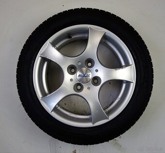 Ford Focus - 15" alu kola - Letní pneu - 7